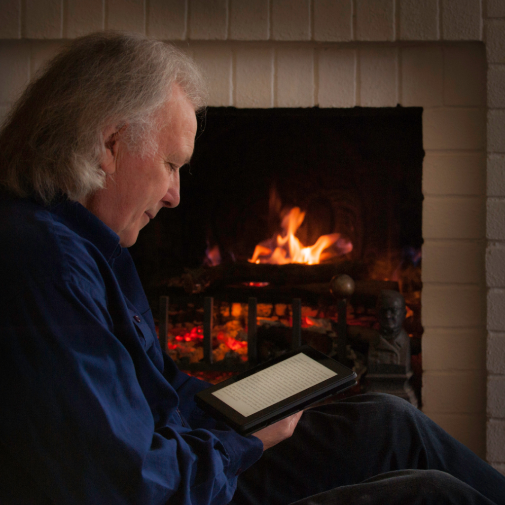 Senior male seated by fireplace | Comfort Keepers Calgary | BLOG POST | 5 Ways to Ensure Your Seniors Fire Safety