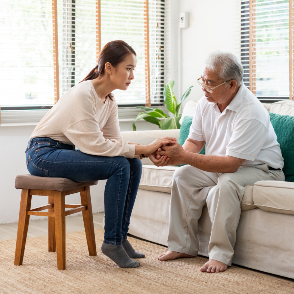 Caregiver sits comforting senior male | Comfort Keepers Calgary | BLOG POST | Home Care Services Improve Senior's Mental Health