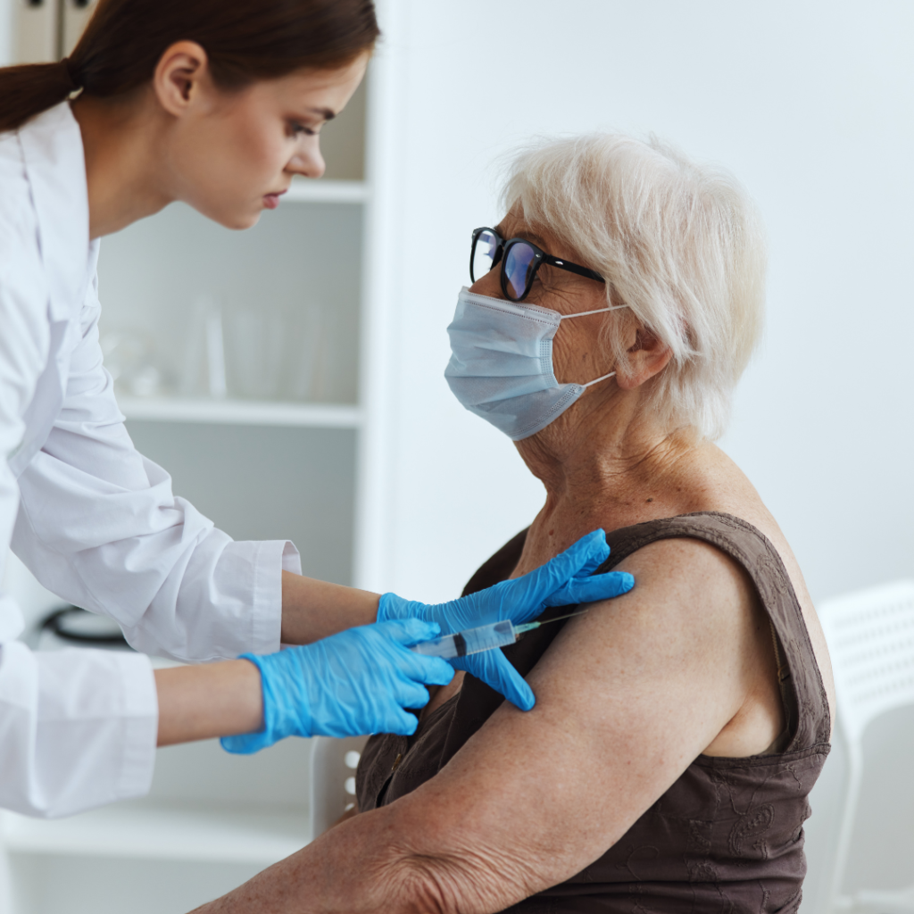 Senior Woman receiving vaccination from a nurse | Comfort Keepers Calgary | COVID-19 Precautions You Can Take | BLOG POST