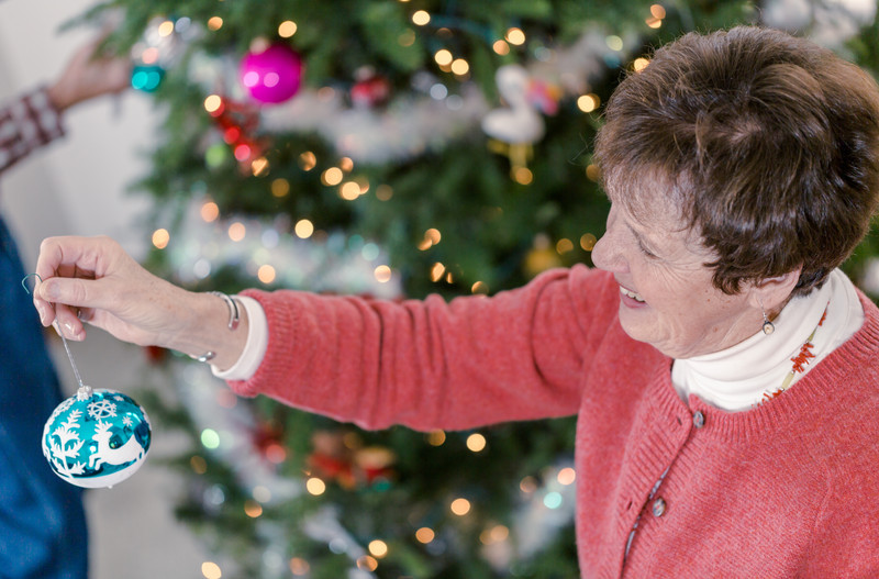 Senior woman decorating Christmas tree | Comfort Keepers Calgary | BLOG POST | Tips for Senior Stress Management