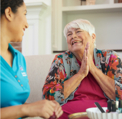 Senior woman with hands clasped smiling at caregiver | Comfort Keepers Calgary | Heart Attacks: What to Look for | BLOG POST