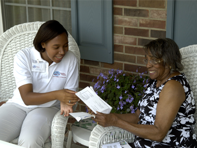 Senior sitting on porch with caregiver | Comfort Keepers Calgary | BLOG POST | The Senior Brain and Poetry