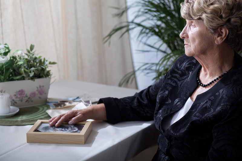 Senior Woman seated at table | Comfort Keepers Calgary | BLOG POST | Palliative Care Services