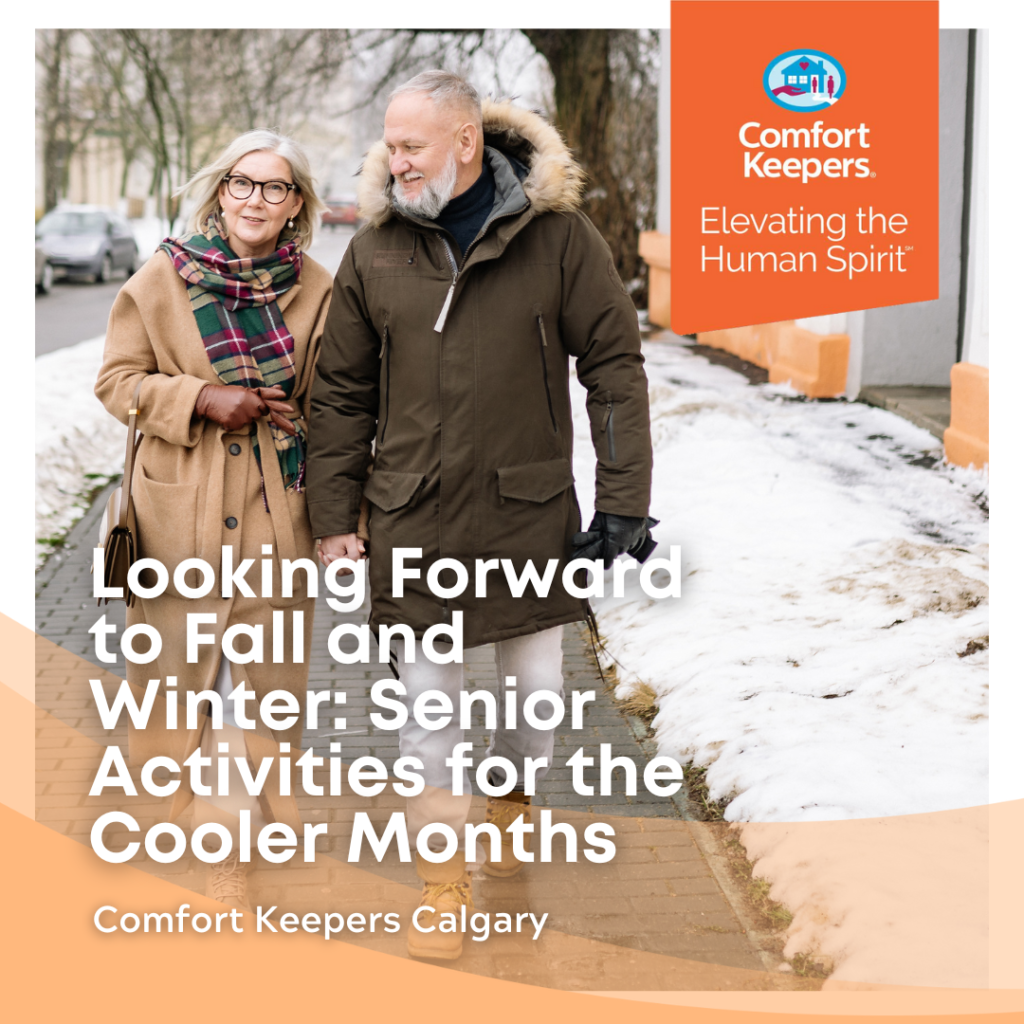 Comfort Keepers Orange Logo| Elevating the Human Spirit | Looking Forward to Fall and Winter: Senior Activities for the Cooler Months | Comfort Keepers Calgary | Two Seniors Walking down a snow cleared sidewalk