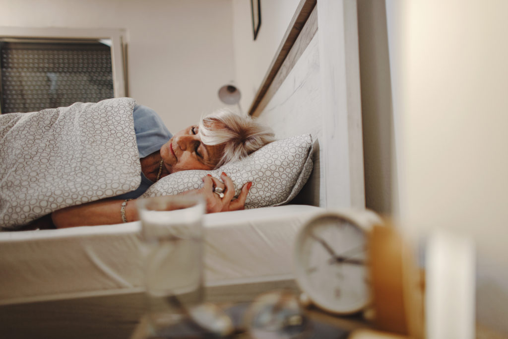 Senior woman sleeping in the bed.