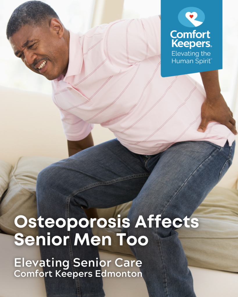 Senior male holding back while getting off couch | Osteoporosis Affects Senior Men Too | Comfort Keepers Edmonton | BLOG POST
