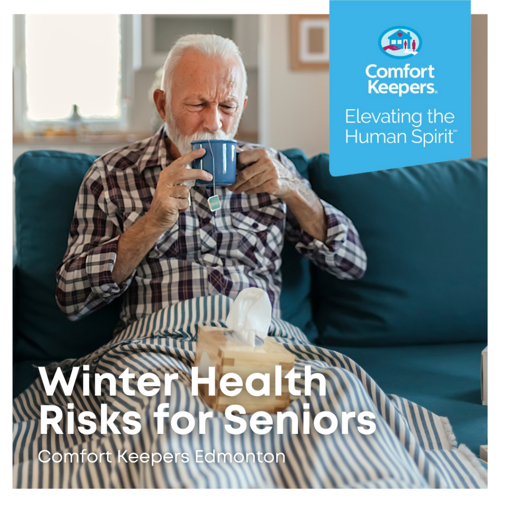 Senior with blanket over knees, sipping tea while seated on couch | Winter Health Risks for Seniors | BLOG POST | Comfort Keepers Edmonton