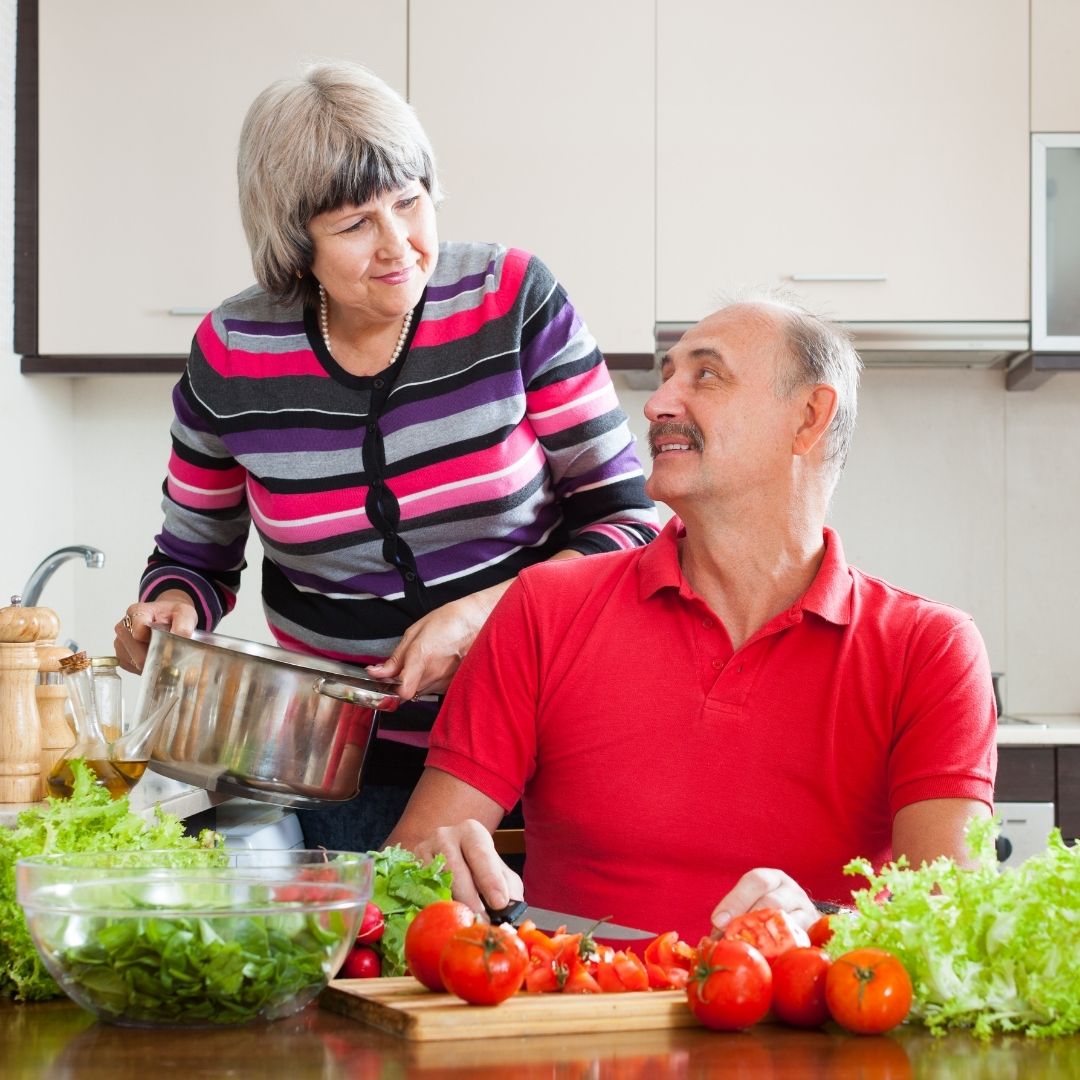 Two people preparing a meal in a kitchen