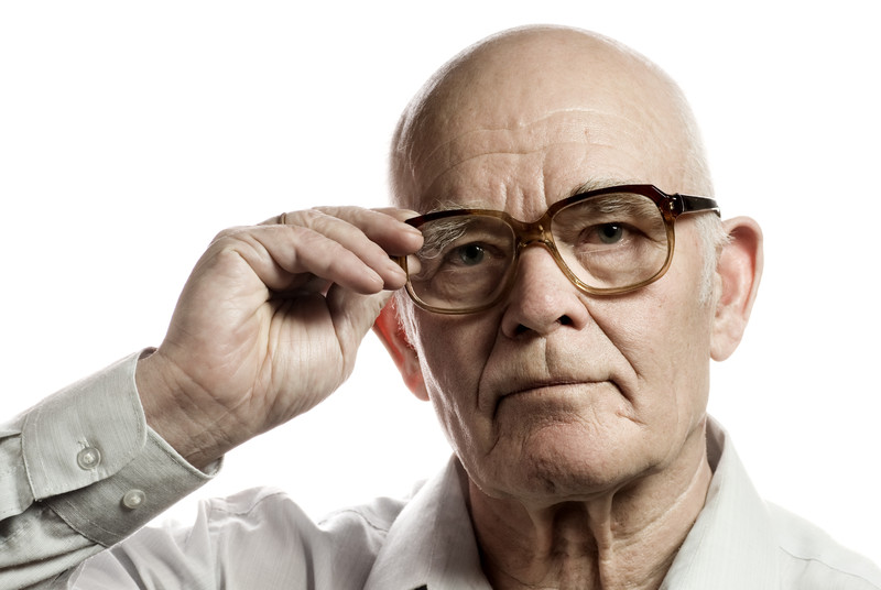 Senior Male Adjusting his Glasses | Glaucoma Facts for Seniors | Comfort Keepers Edmonton | BLOG POST