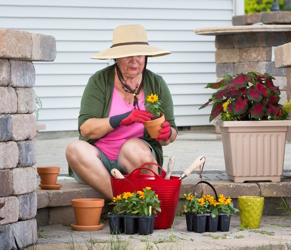 Senior woman sitting on front step gardening | Comfort Keepers Edmonton | BLOG POST | Home Care for Seniors
