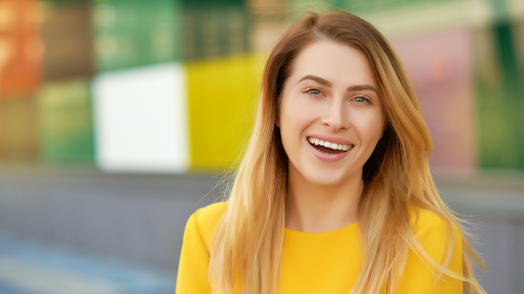 5 Morning Rituals Caregivers Can Use to Jumpstart Their Day! - Woman Smiling at Camera in Apparent Happy Mood