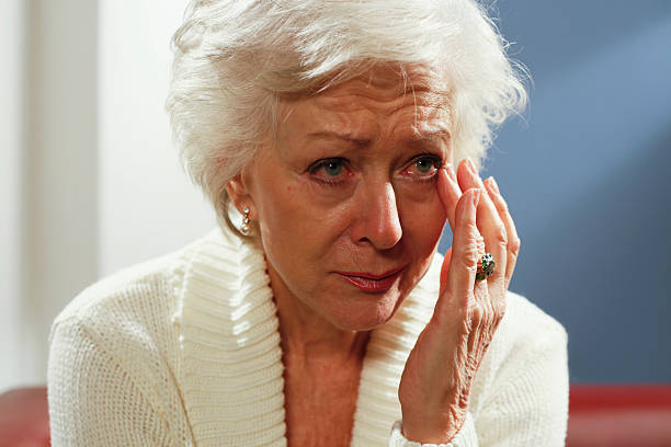 Senior woman wiping tears from her eyes | Senior Crying | Comfort Keepers Georgian Triangle | BLOG POST