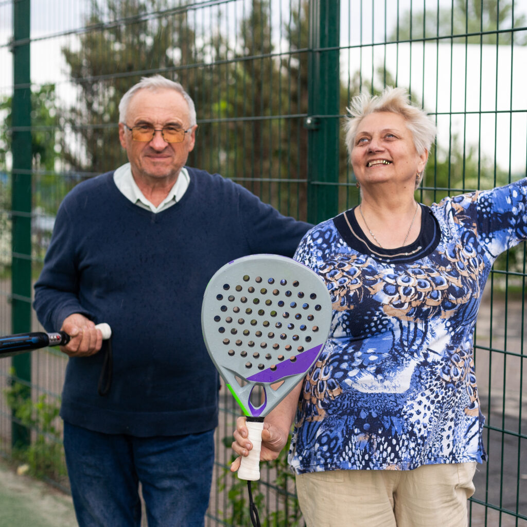 Senior woman in action on a Pickleball court, showing role in maintaining agility and cardiovascular health.