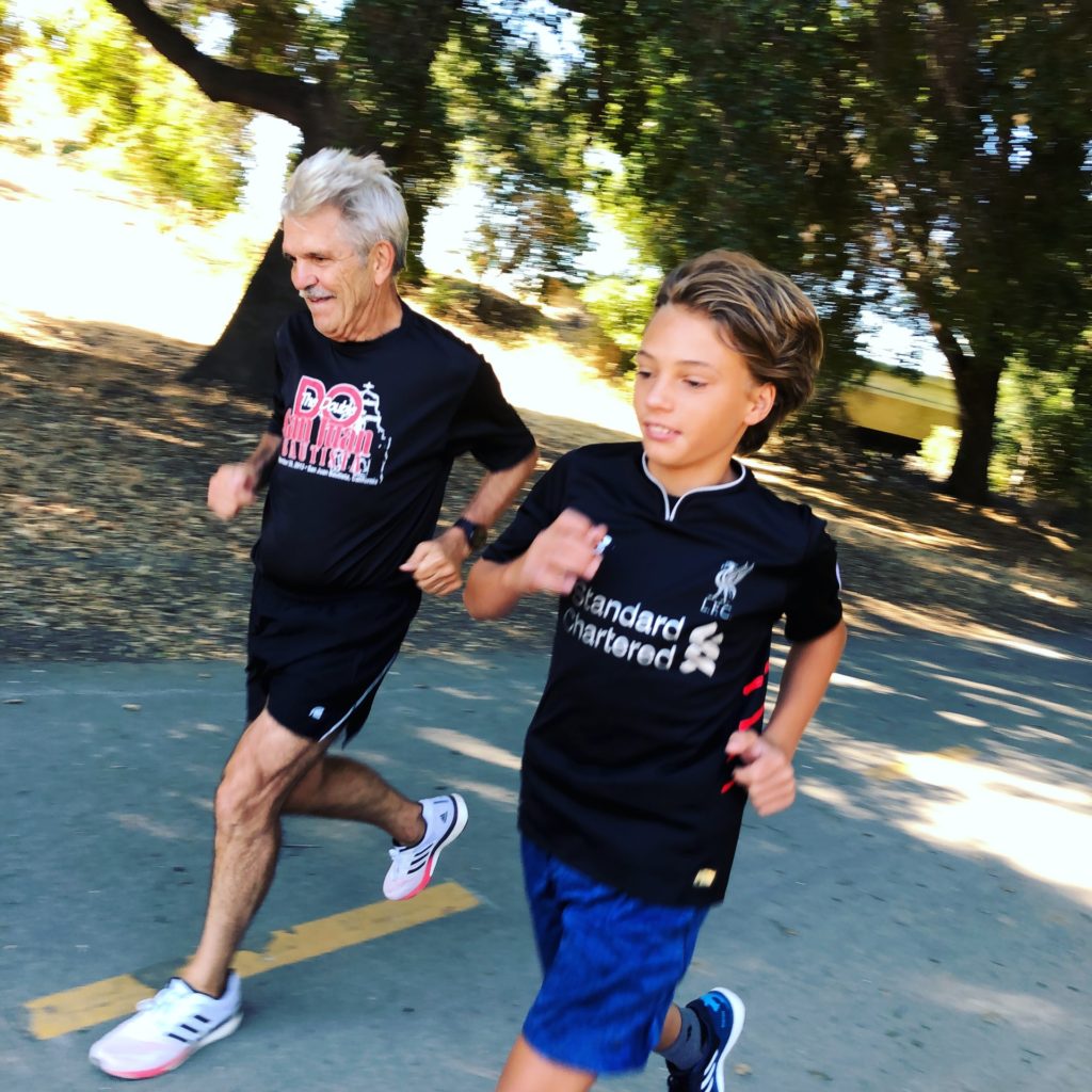 A young boy and an elderly man going for a run together; this discusses the ability of age, despite what others think about seniors in retirement