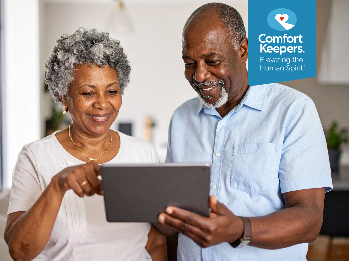 A pair of seniors playing on their tablet | North and West Vancouver Seniors and the Positive Impact of Social Media | Comfort Keepers North and West Vancouver