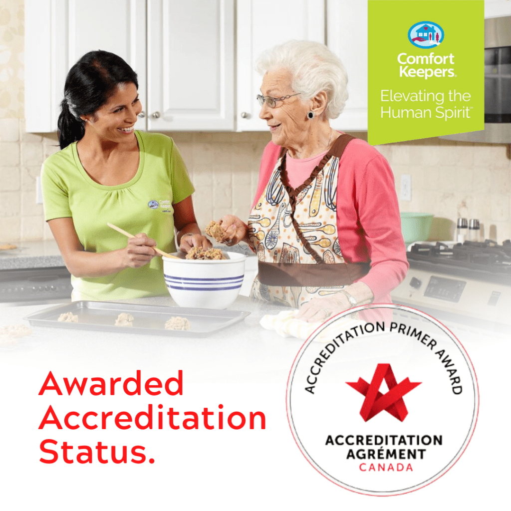 Comfort Keepers North & West Vancouver Awarded Accreditation | Image of Senior baking with Caregiver | BLOG POST
