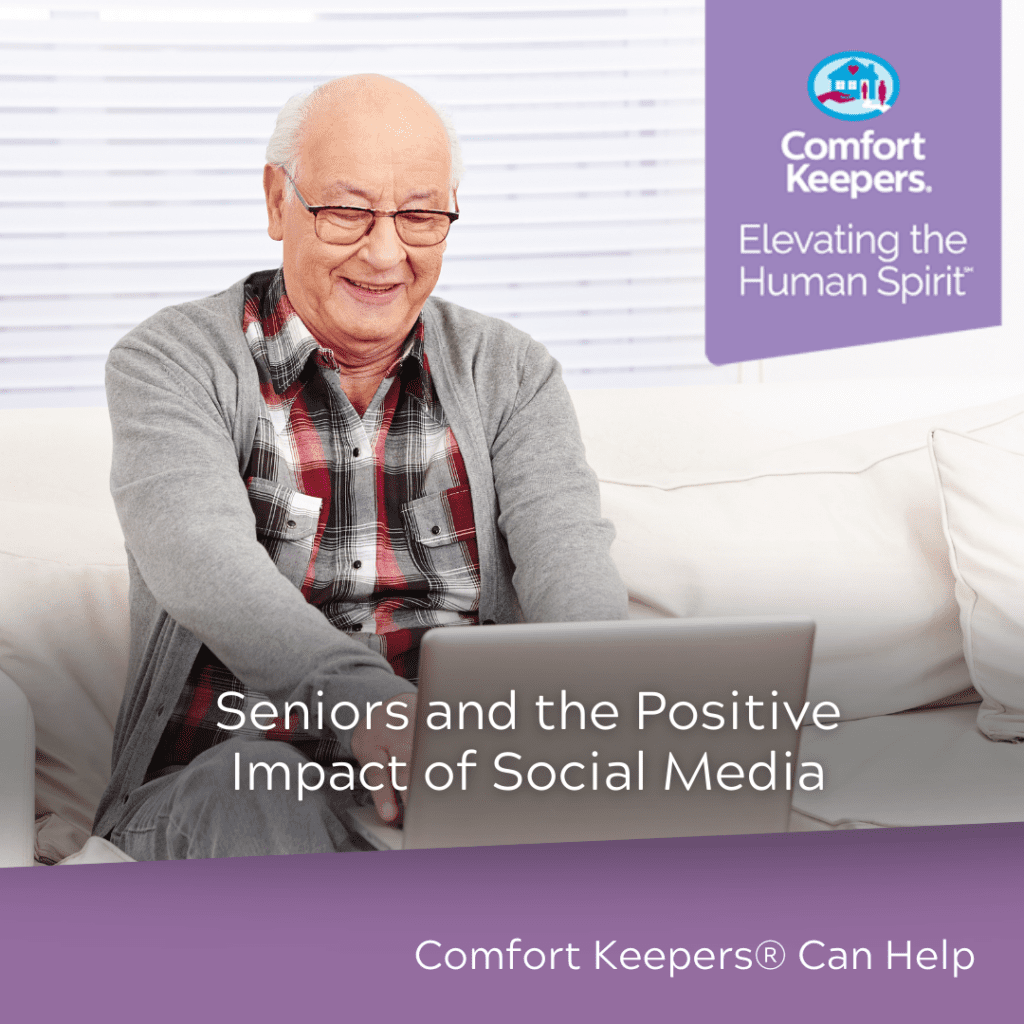 Senior using laptop and smiling | The Positive Impact of Social Media for Seniors | BLOG POST | Comfort Keepers North and West Vancouver