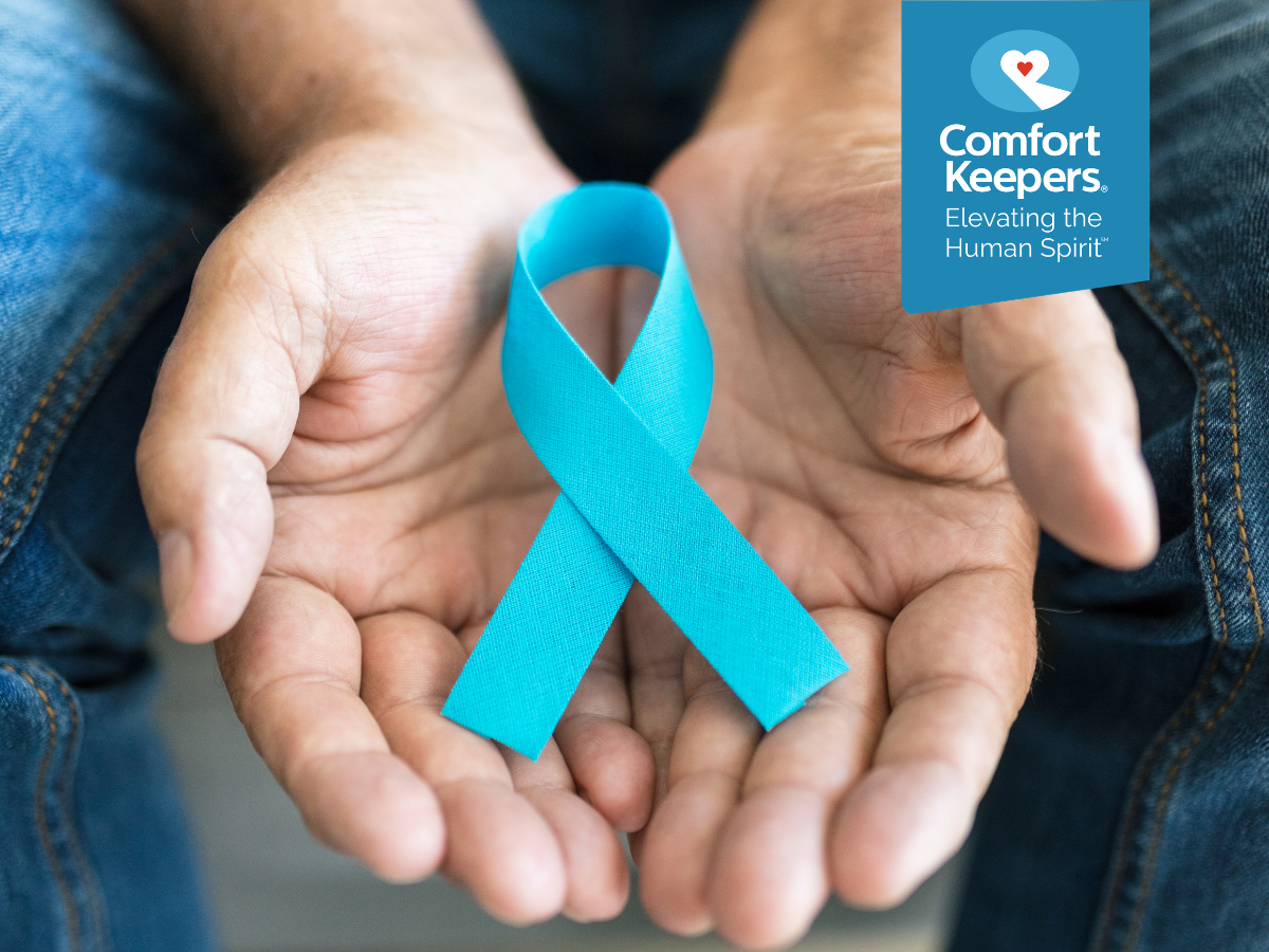 A pair of hands holds a blue cancer ribbon | Cancer Prevention in Seniors from a Senior Care Agency | Comfort Keepers North and West Vancouver