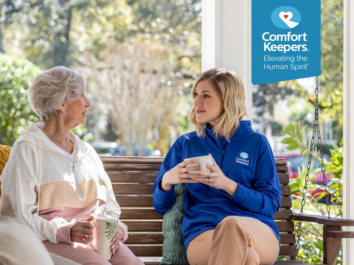 A senior woman sits on the front porch with her caregiver | Vitamin D Deficiency and Its Effects for Seniors Living in British Columbia | Comfort Keepers North and West Vancouver