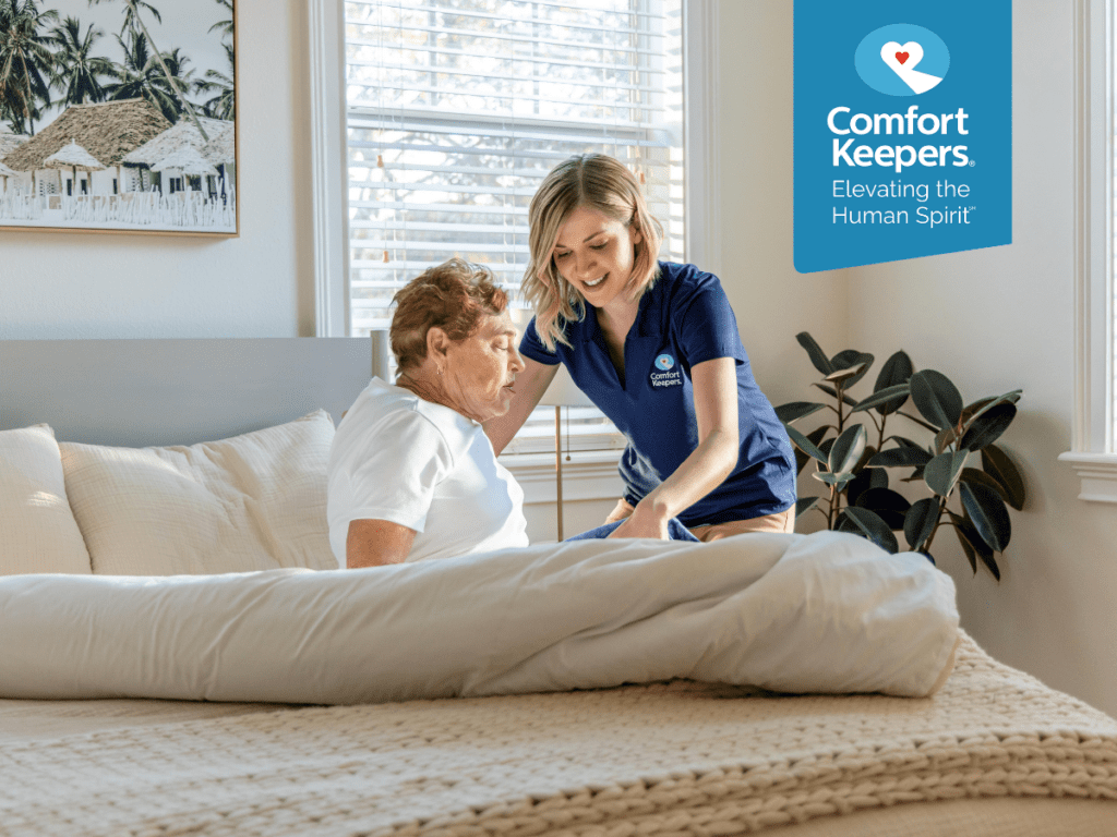 A senior woman is assisted by her caregiver while getting out of bed | Senior Health and Well-Being: How Much Sleep Do Our Elderly Loved Ones Need? | Comfort Keepers North and West Vancouver