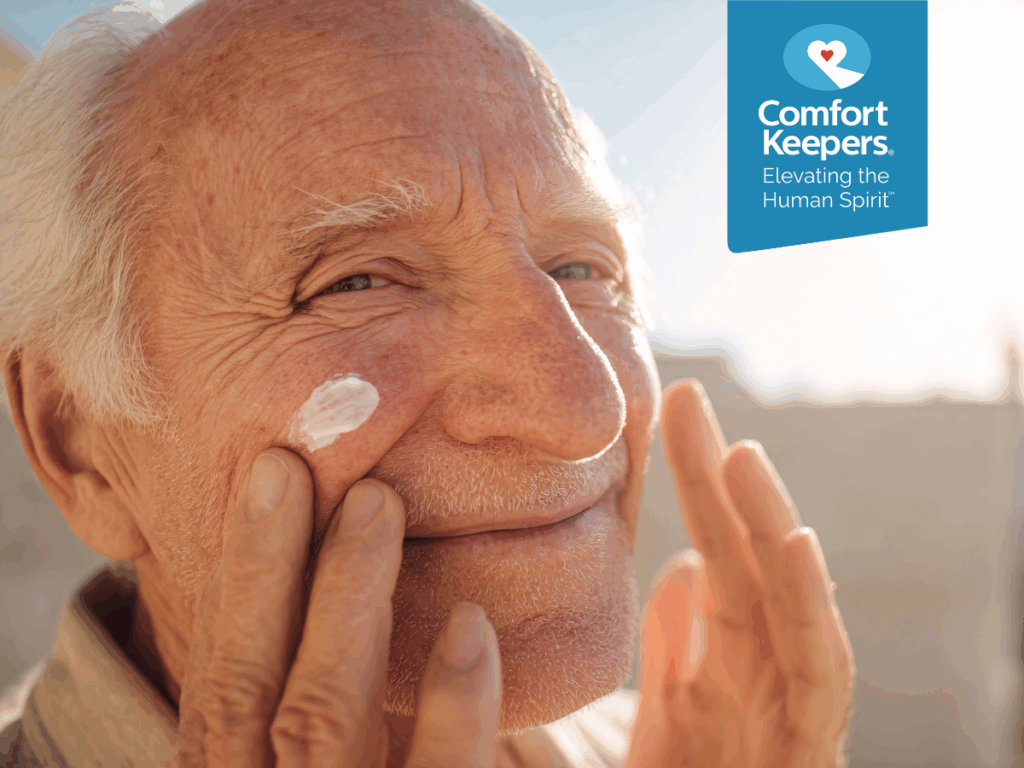 A senior man applies sunscreen | Skin Protection Tips for British Columbia Seniors | Comfort Keepers North and West Vancouver