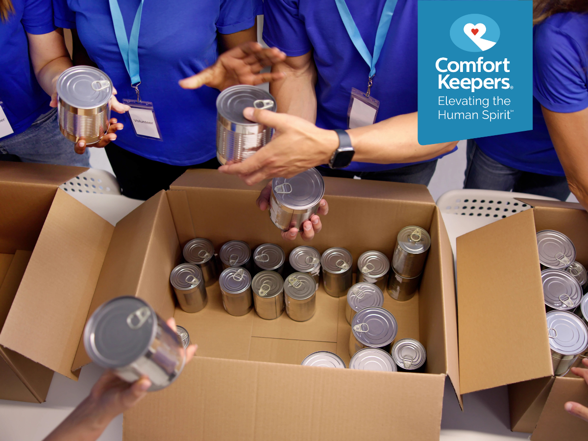 A box being filled with canned goods | Preparing Seniors for Natural Disasters | Comfort Keepers North and West Vancouver