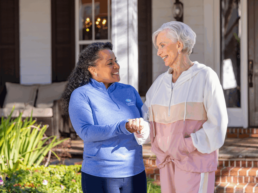 Senior woman walking with caregiver | Maximizing Comfort & Connection with In-Home Palliative Support | Comfort Keepers North and West Vancouver | BLOG POST