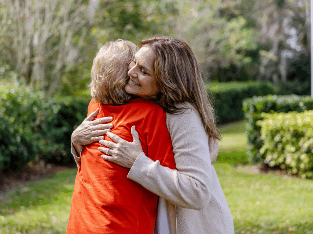 Senior woman and daughter embrace | The Silent Burden: Understanding Caregiver Stress in Palliative Care Families | Comfort Keepers North and West Vancouver | BLOG POST