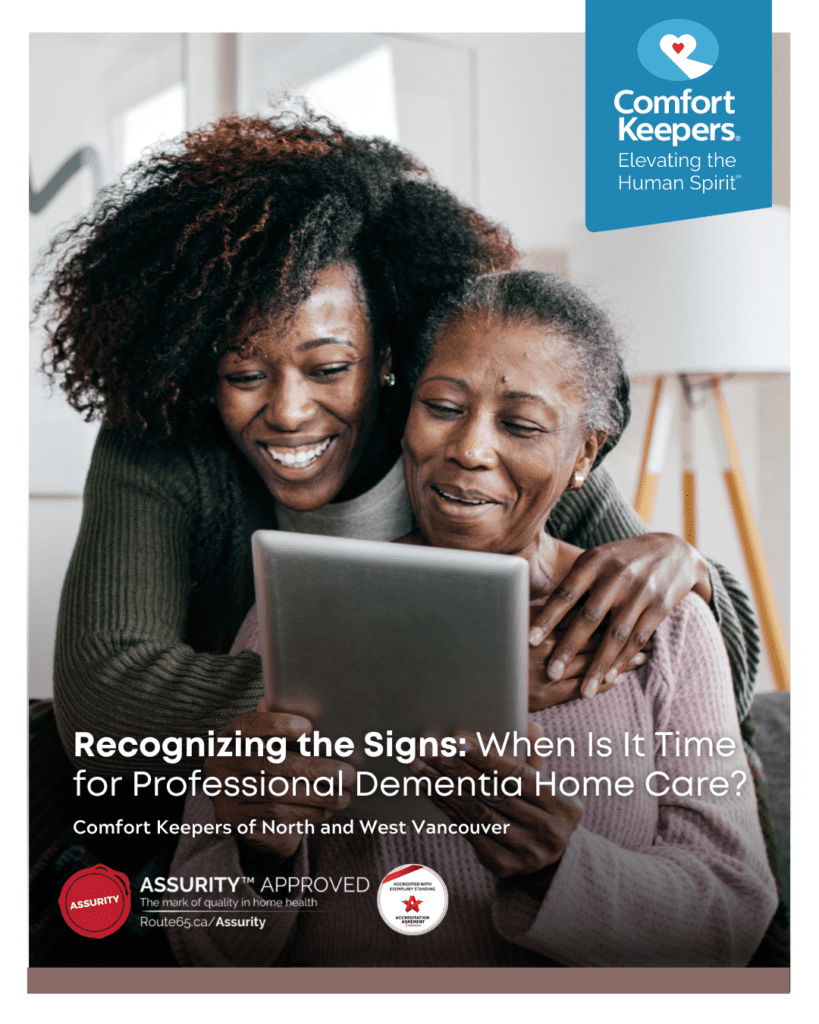 A senior and her daughter looking at a tech device | Comfort Keepers North and West Vancouver