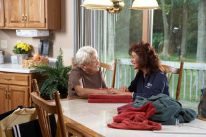 Janet, the Comfort Keepers in-home care assistant, shared a laugh and had a great time sitting in the dining area with a senior client.

