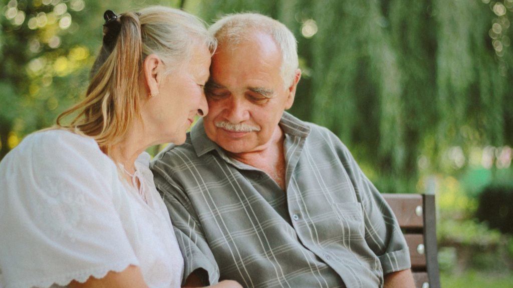 Senior man and woman talking together