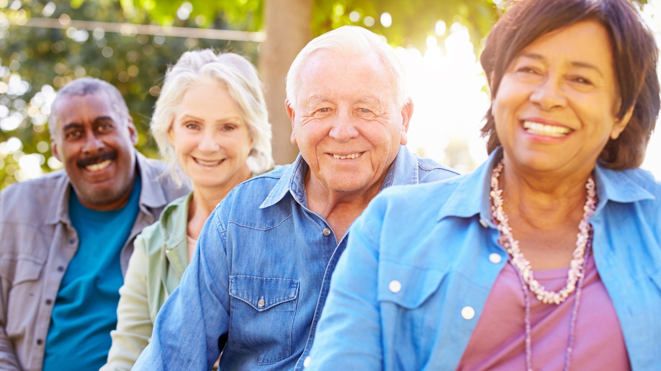 Group of four senior adults sharing time and friendship as companions 