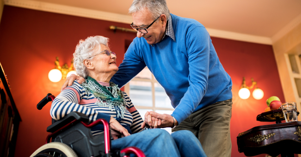 Woman in wheel chair chatting with her partner in their home