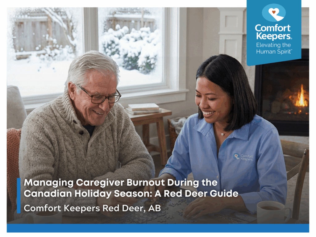 Senior and caregiver seated on couch | Managing Caregiver Burnout During the Canadian Holiday Season: A Red Deer Guide | Comfort Keepers Red Deer