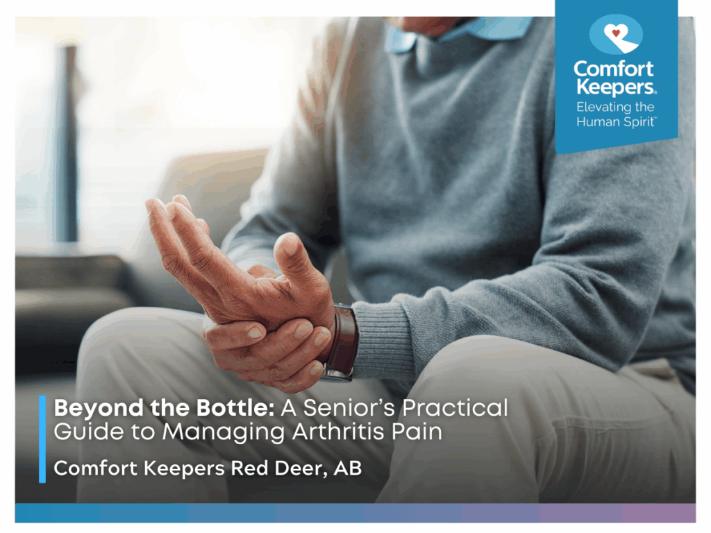 A senior holding his own hand, seemingly in pain | Beyond the Bottle: A Senior's Practical Guide to Managing Arthritis Pain | Comfort Keepers Red Deer