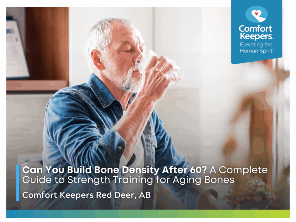 A senior man sits at a table and drinks a glass of water | Can You Build Bone Density After 60? A Complete Guide to Strength Training for Aging Bones | Comfort Keepers Red Deer
