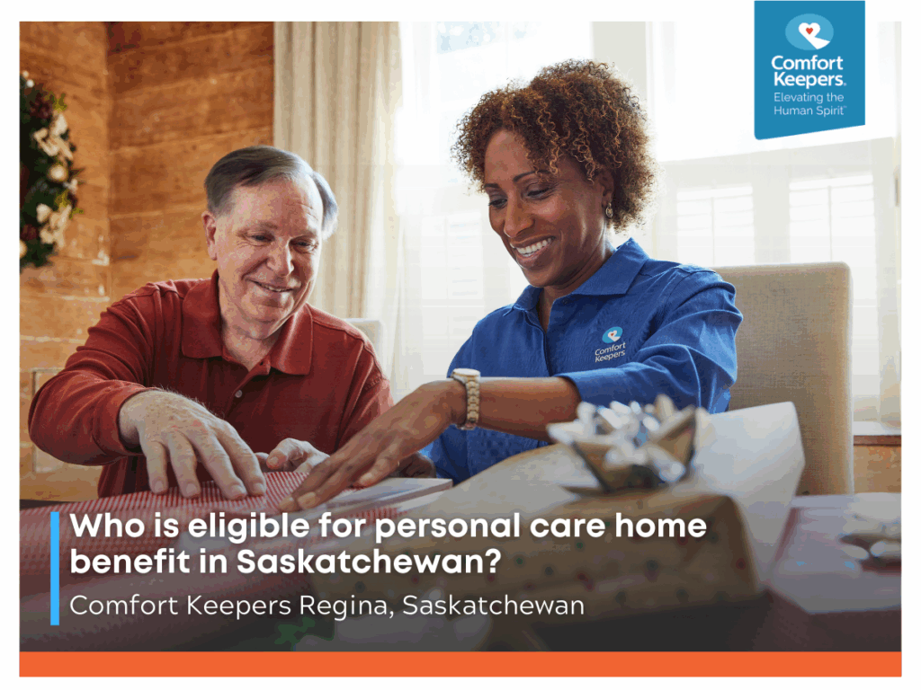 A senior male wrapping gifts with his caregiver | Who is eligible for personal care home benefit in Saskatchewan? | Comfort Keepers Regina