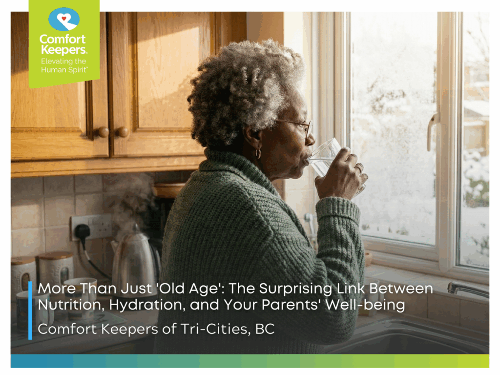 A senior woman drinks a glass of water while looking out the window | The Surprising Link Between Nutrition, Hydration, and Your Parents' Well-being | Comfort Keepers Tri-Cities