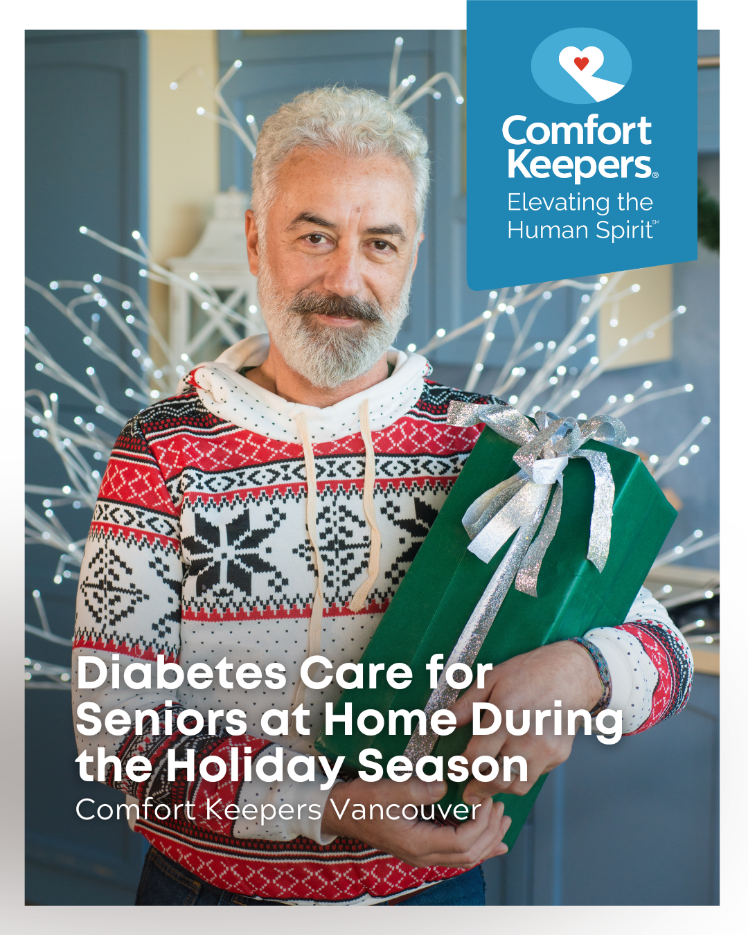 A senior male wearing a holiday sweater holds gift. | Diabetes Care for Seniors at Home During the Holiday Season | Comfort Keepers Vancouver | BLOG POST