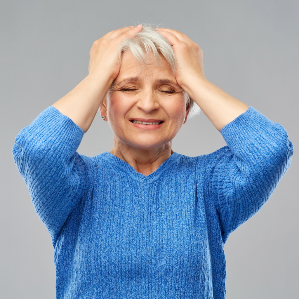 Senior with hands to head seemingly stressed | Stress Relief Techniques | BLOG POST | Comfort Keepers Vancouver
