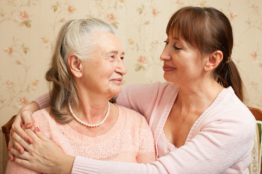 Senior with caregiver, smiling | Benefits of 24-Hour Home Care | Comfort Keepers Vancouver | BLOG POST