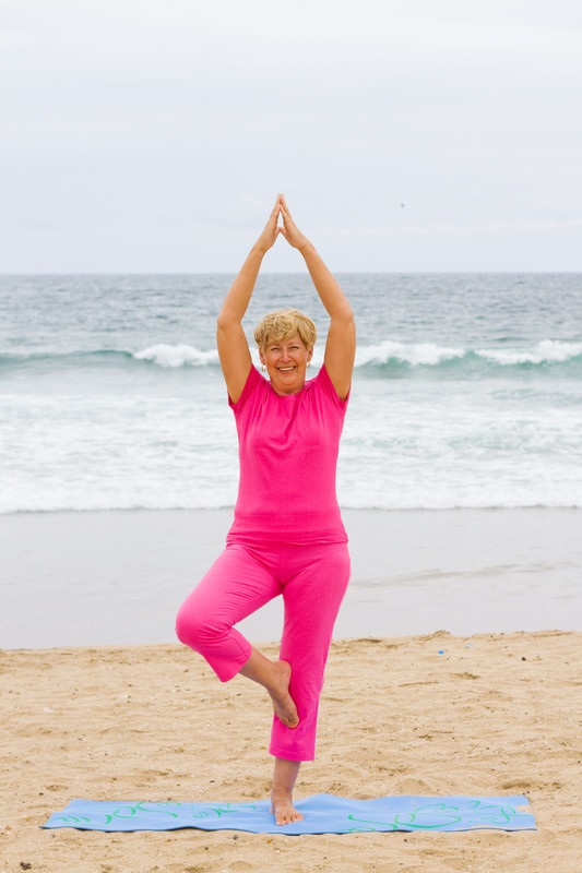 Senior women on the beach in yoga pose | Comfort Keepers® Caregivers | BLOG POST | Comfort Keepers Vancouver