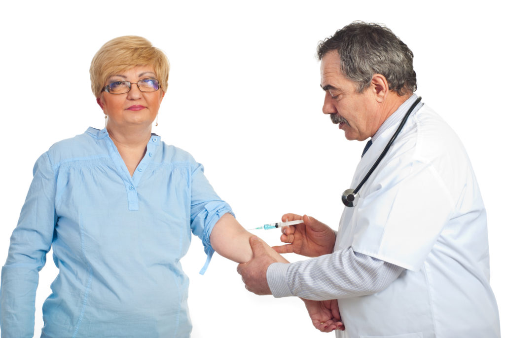 Senior receiving immunization from doctor | Senior Immunizations | BLOG POST | Comfort Keepers Vancouver