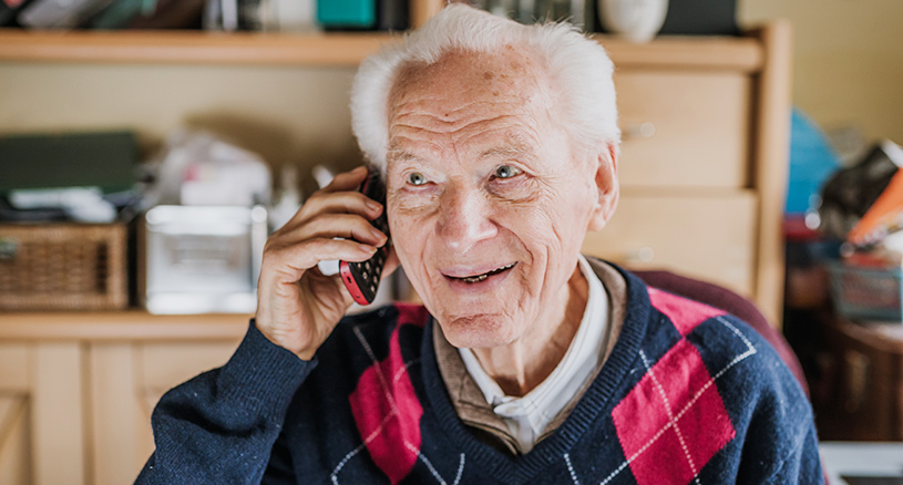 Senior Male on the phone and smiling | Connect with Seniors this Christmas | BLOG POST | Comfort Keepers Vancouver