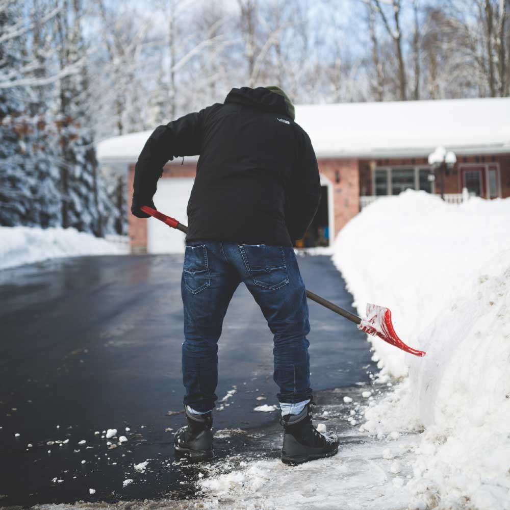 Male shoveling driveway | Safe Snow Removal Tips for Seniors | BLOG POST | Comfort Keepers Vancouver