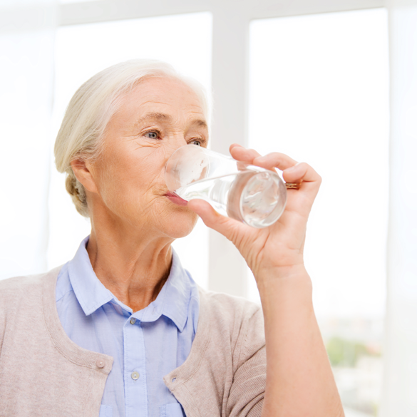 Senior Woman drinking water | Dehydration in Seniors | Comfort Keepers Vancouver | BLOG POST