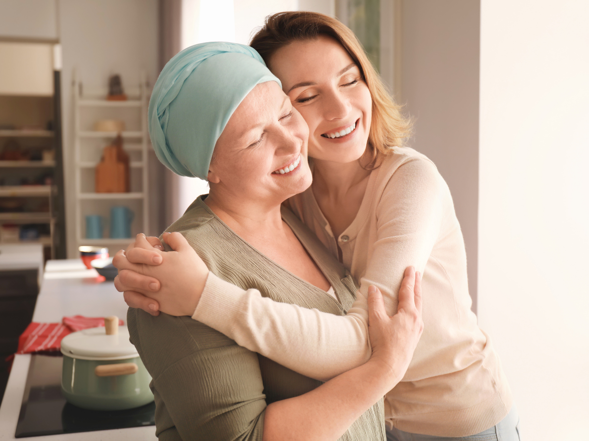 A senior with cancer embraced by daughter | Helping Victoria's Seniors Deal with Late-in-Life Cancer Diagnosis | Comfort Keepers Victoria