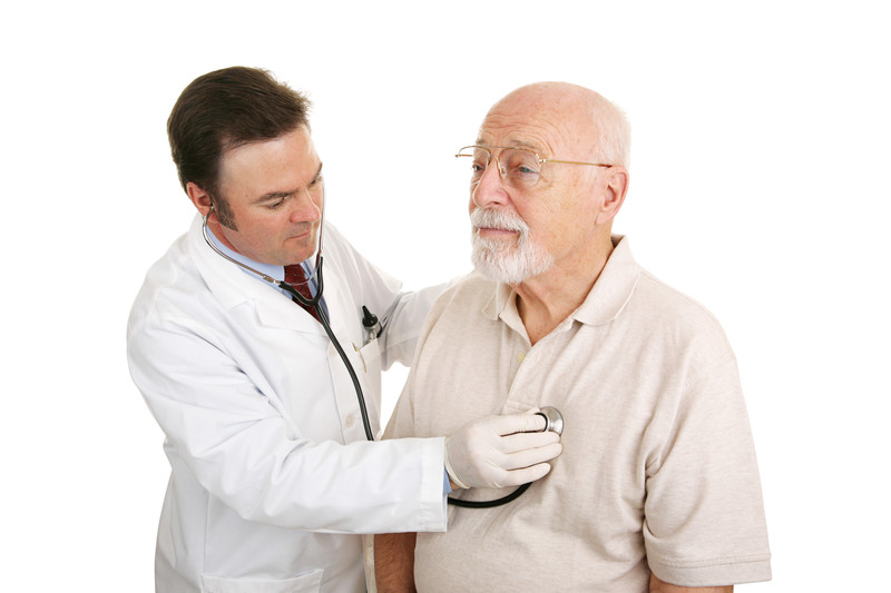 Doctor examining senior patient's heart | Heart Attack | BLOG POST | Comfort Keepers Victoria