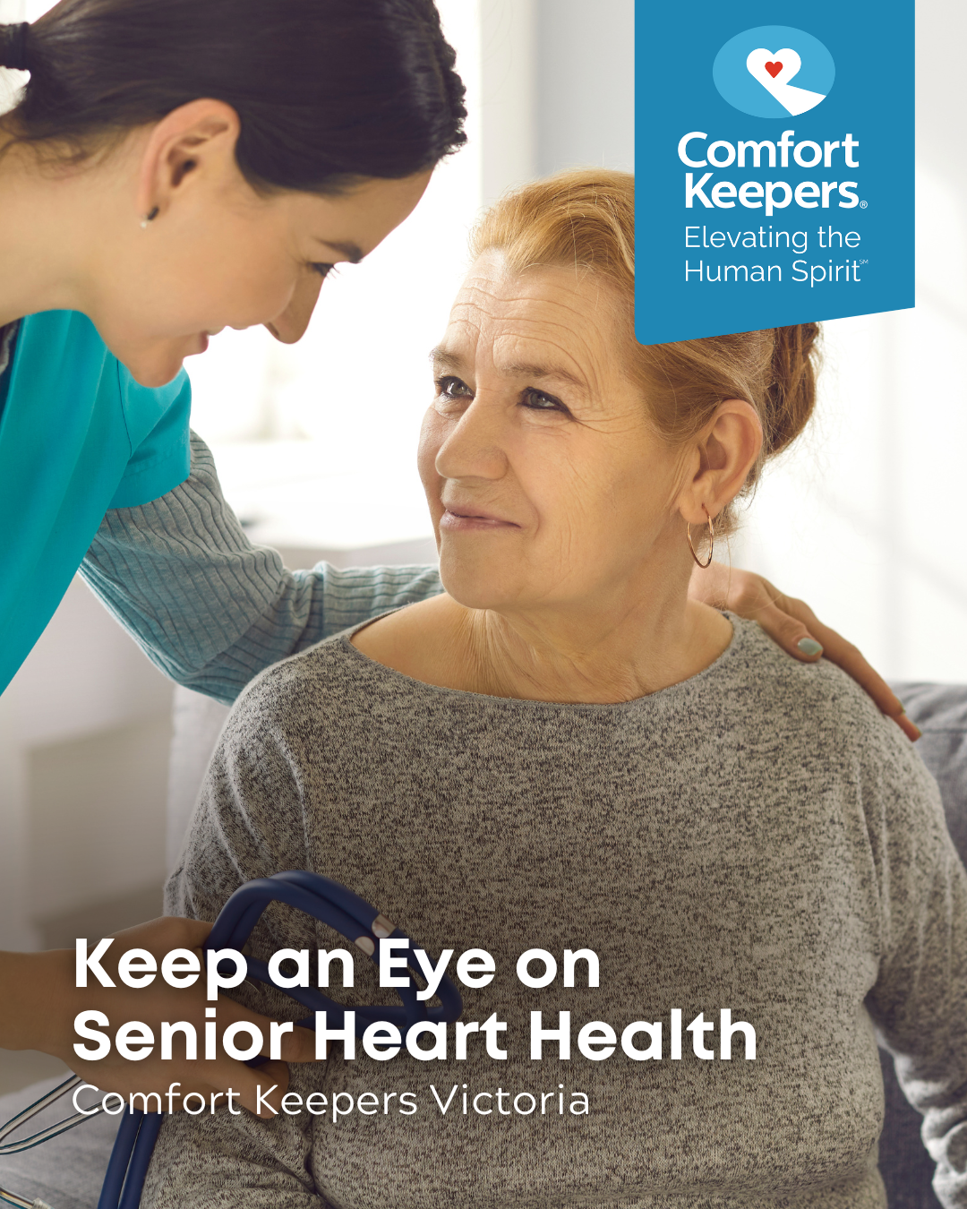 Senior woman with a caregiver. The caregiver is holding a stethoscope | Keep an Eye of Heart Health | Comfort Keepers Victoria | BLOG POST