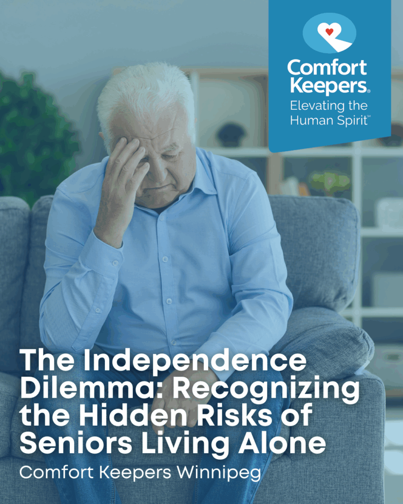 Senior male seated on couch with head resting in hand | Comfort Keepers Winnipeg | The Independence Dilemma: Recognizing the Hidden Risks of Seniors Living Alone | BLOG POST